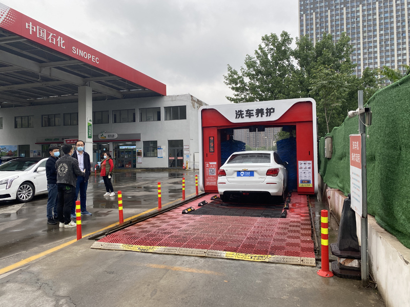 Rollover car wash system at gas station